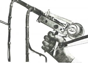 1965 photograph of the Tyton continuous strap bundling system